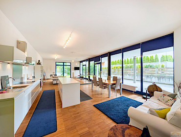 Modernly furnished living room with dining area