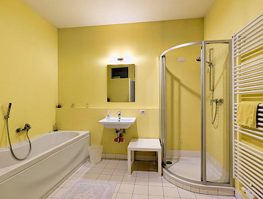 Bathroom with bathtub and separate shower