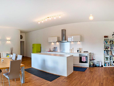 open-plan modern kitchen featuring a sleek island
