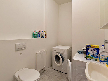 laundry room with washing machine, dryer, and toilet