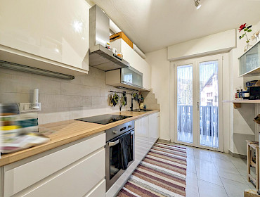 bright kitchen with access to the balcony